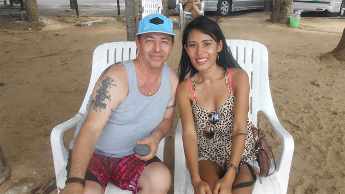 A photo of an international couple at a Thai beach