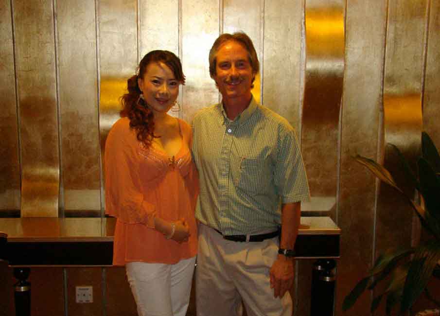 A photo of a Western man and a Chinese woman